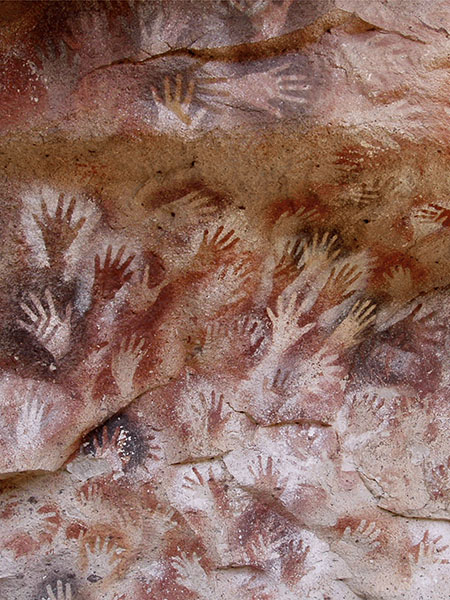Positive and negative handprints created with red ochre or manganese dioxide. Cueva de las Manos, Argentina, 11.000-7.500 BC.